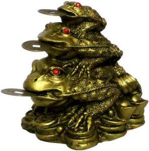 Aakriti Resin Feng Shui Money Frogs Three Legged Toads Hold Two Ignots on a Pile of Money for Wealth Luck Legged Money Frog on Bed of ingots Showpiece Gold Color Decorative Showpiece - 8.5 cm (Polyresin, Gold)
