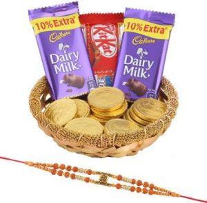 Cadbury Golden Treat Chocolates | Premium Om Rakhi Gift On Blessing Festival | Rakhi With Premium Chocolates | Premium Rakhi Gift | Designer rakhi | PREM OM21333 Combo (1 Golden Katory - 2 Dairy Milk (13.2g) - 1 Kitkat (12.8g) - 5 Gold Coin Chocolates - 1 Premium Om Rakhi)